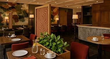Loungeruimte met open haard van Fletcher Hotel-Restaurant Victoria-Hoenderloo